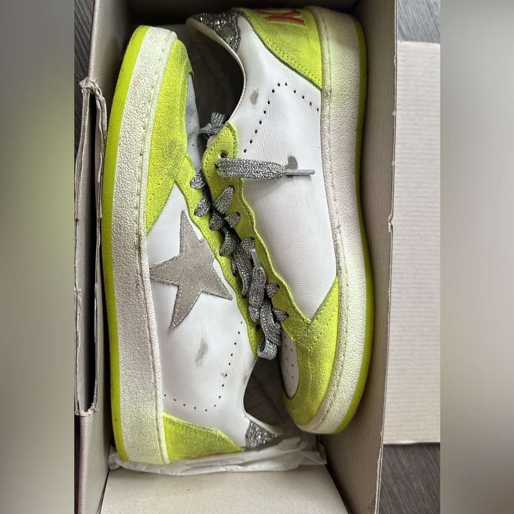 Golden goose women's sneakers with silver metallic shoe laces.